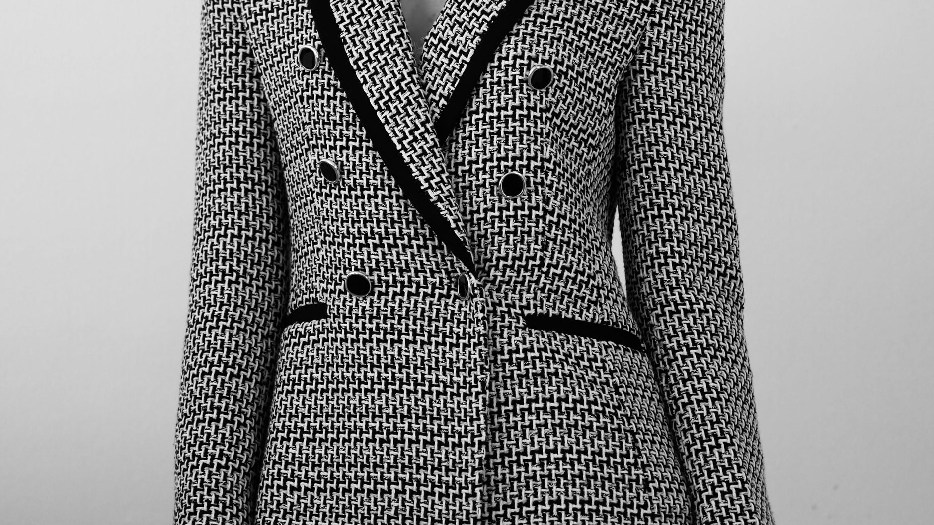 Chic black and white tweed blazer perfect for high fashion elegant attire.
